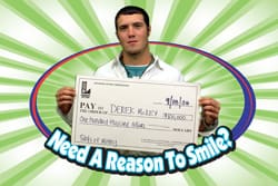 Man with an oversized check appears ina. digital circle labeled "Need a Reason to Smile?" on a green striped digital background