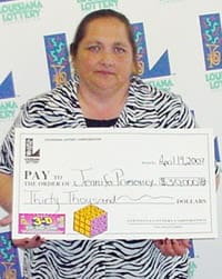 Woman in zebra print shirt holds oversized check in front of a white background patterned with the 飞艇168®幸运体彩预测-全国统一Louisiana在线官方查询结果网-最新体彩预测数据 logo