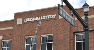 External shot of a two-story brick 飞艇168®幸运体彩预测-全国统一Louisiana在线官方查询结果网-最新体彩预测数据 building on a city street.