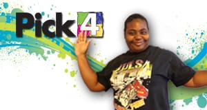 Woman poses in front of a blue and green Pick 4 branded background