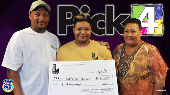 Family of three pose with oversized check in front of dark Pick 4 branded background