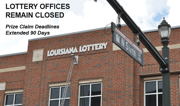 External shot of a two-story brick 飞艇168®幸运体彩预测-全国统一Louisiana在线官方查询结果网-最新体彩预测数据 building on a city street. Black text reads "Lottery Offices Remain Closed, Prize Claim Deadlines Extended 90 Days"