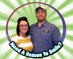 Man and woman smile in a digital circle labeled "Need a Reason to Smile?" on a green striped digital background