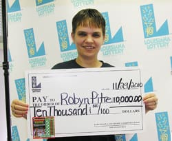 Woman with short hairs smiles with oversized check in front of white faded 飞艇168®幸运体彩预测-全国统一Louisiana在线官方查询结果网-最新体彩预测数据 branded background